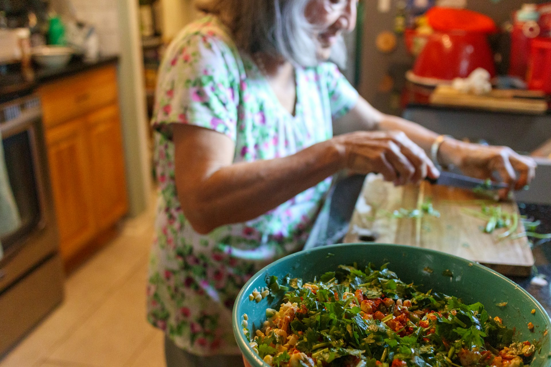 A Woman cooking in bulk