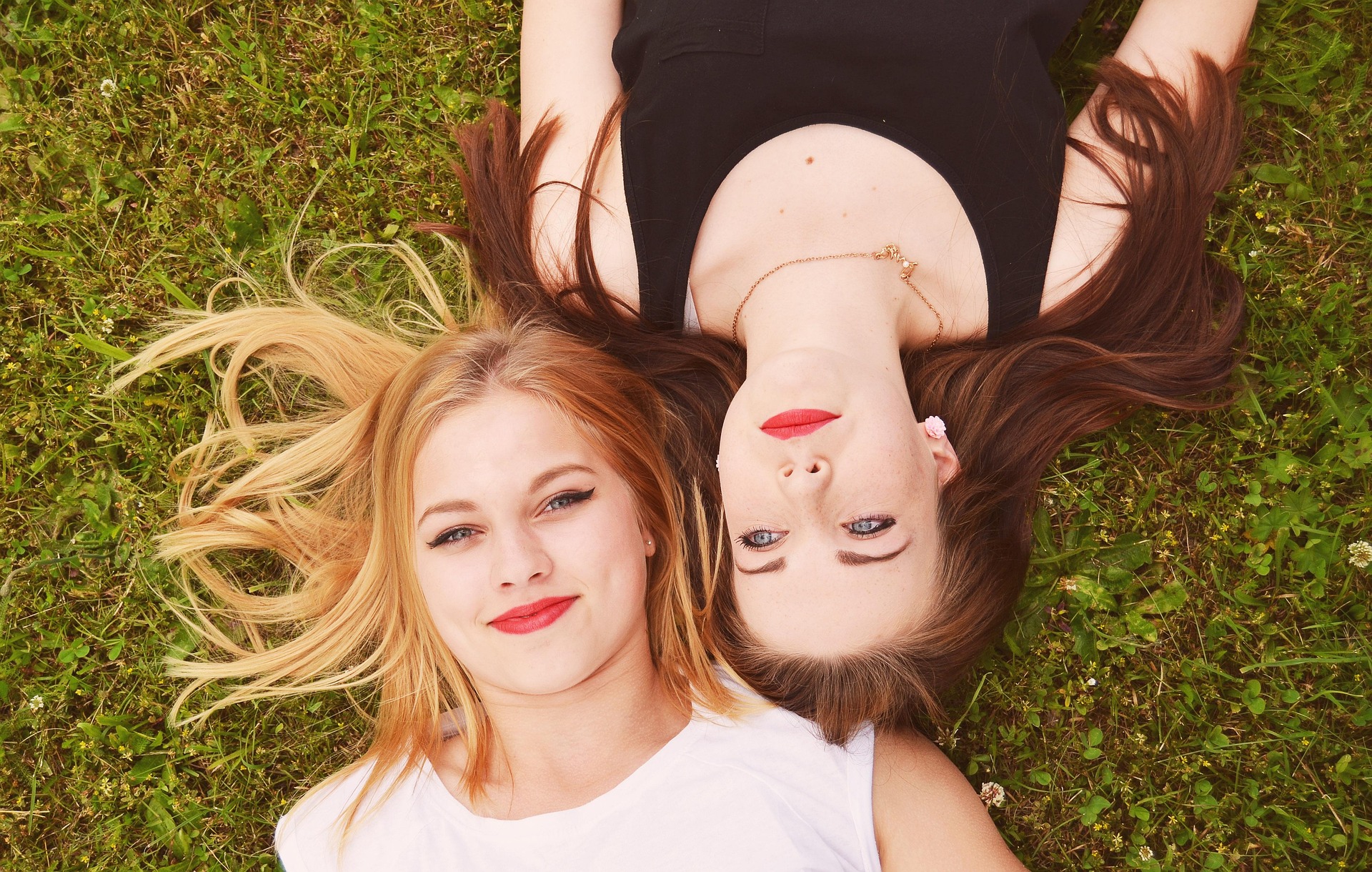 Two Women laying on the grass