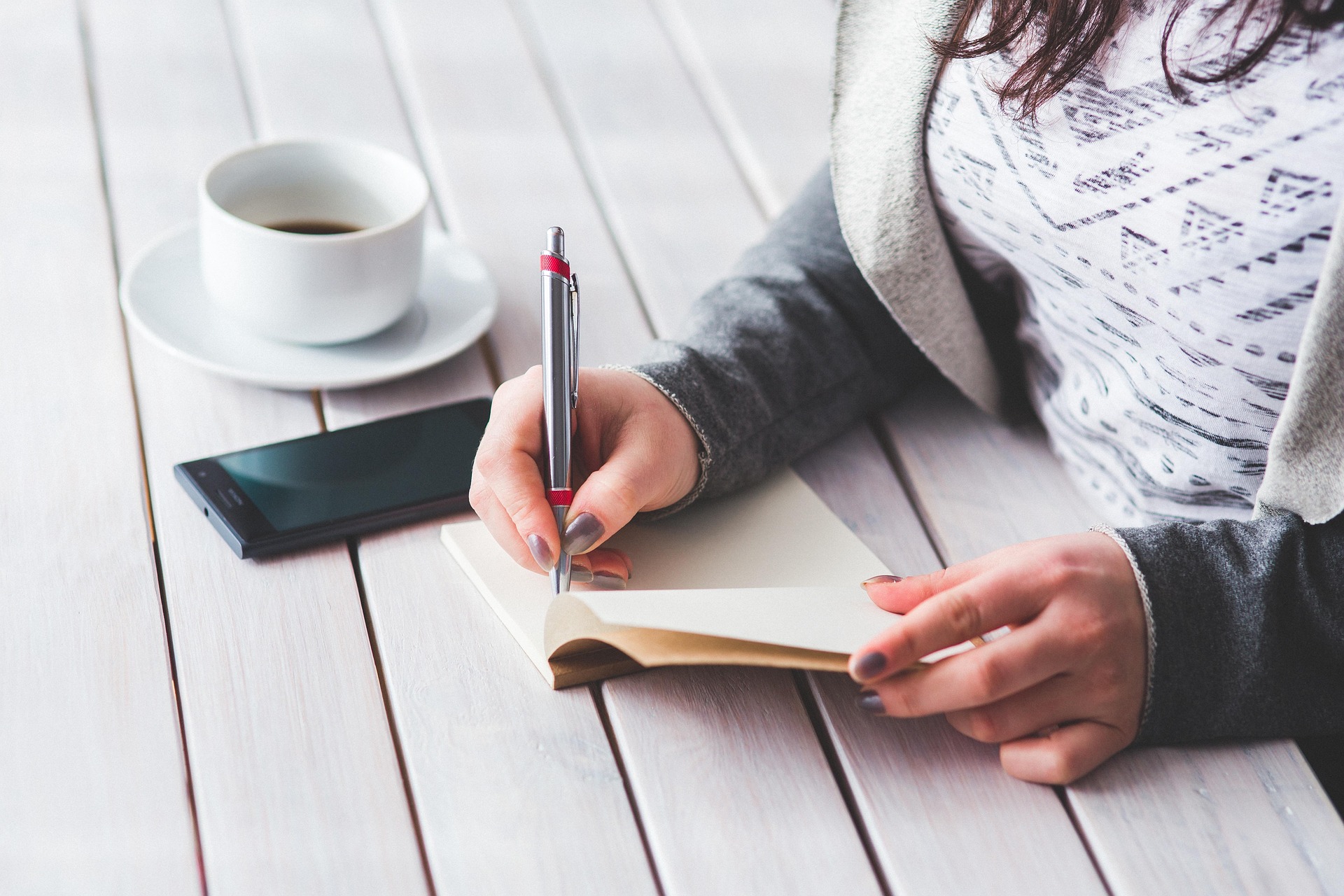 A Woman writing a Journal